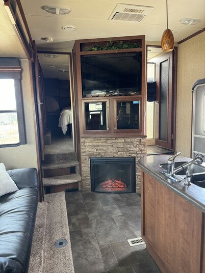 Cozy RV tucked back in a quiet property with plenty of room to relax