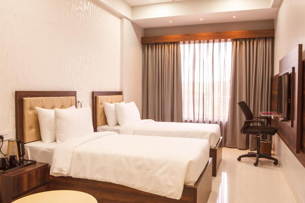 Habitación Deluxe con 1 cama doble o 2 individuales | Tabla de planchar con plancha