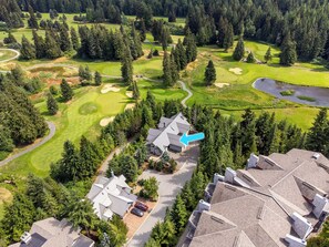 A residential area with a golf course, houses, and a large building with a pointed roof. - Located overlooking the Whistler Golf Course, mountain charm, unbeatable views (Whistler)