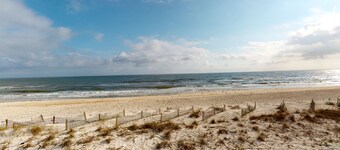 East-end SGI condo with Gulf views, beach access, on-site pool, & private W/D