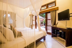 A room with a bed, a TV, and a sound system. - Luxury Private Villa in Heart of Seminyak (Seminyak)