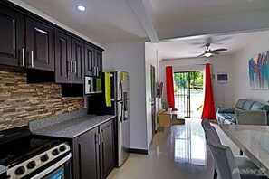 Fridge, microwave, oven, stovetop - Colorful Condo w/ Community Pool and Walking Distance from the Beach (Coco)