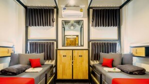A room with two beds, a wardrobe, and an air conditioning unit. - Episode 11 Hostel Sukhumvit (Bangkok)