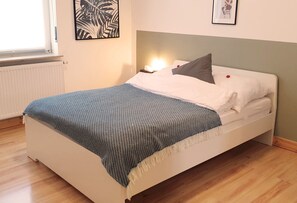 1 bedroom, desk, iron/ironing board, travel crib