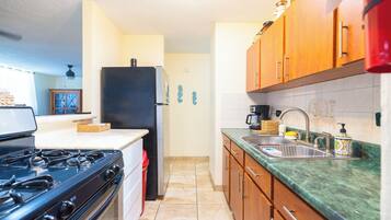 Fridge, microwave, stovetop, coffee/tea maker