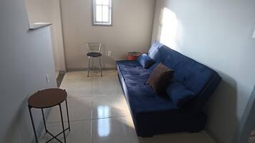 Apartment | Living area | 32-inch flat-screen TV with satellite channels