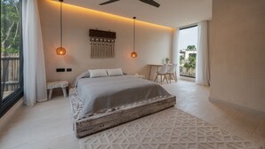 A modern bedroom with a large bed, two pendant lights, a ceiling fan, and a view of the outdoors. - Villa Tovar Tulum / Private Pool/ Starlink Wi-Fi / Mayan Jungle.  (Tulum)