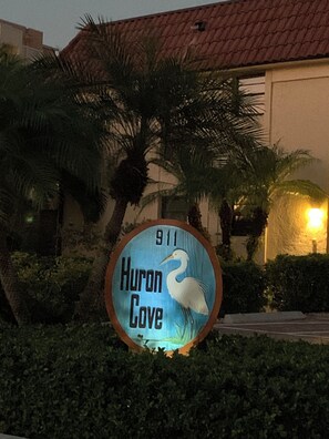 A sign with a heron and the text 'Huron Cove' and the number '911'. - Desirable Gulf location- near the tip of Marco- Get out of the cold…. Location.. (Marco Island)