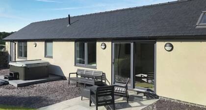 This immaculate cottage with hot tub will not disappoint.