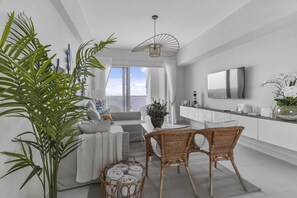 Smart TV - Caribbean Sunshine Breath Beachfront Apartment (Playa Juan Dolio)