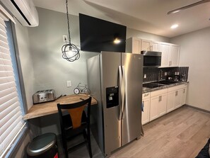 Fridge, microwave, stovetop, coffee/tea maker