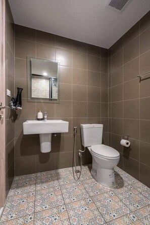 A bathroom with a toilet, sink, and shower. - Lacasita Huahin Near beach  (Hua Hin)