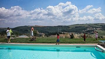 Indoor pool, seasonal outdoor pool, pool umbrellas, pool loungers