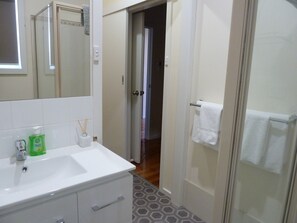 Shower, hair dryer, towels, soap