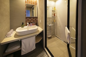 Shower, hair dryer, slippers, towels