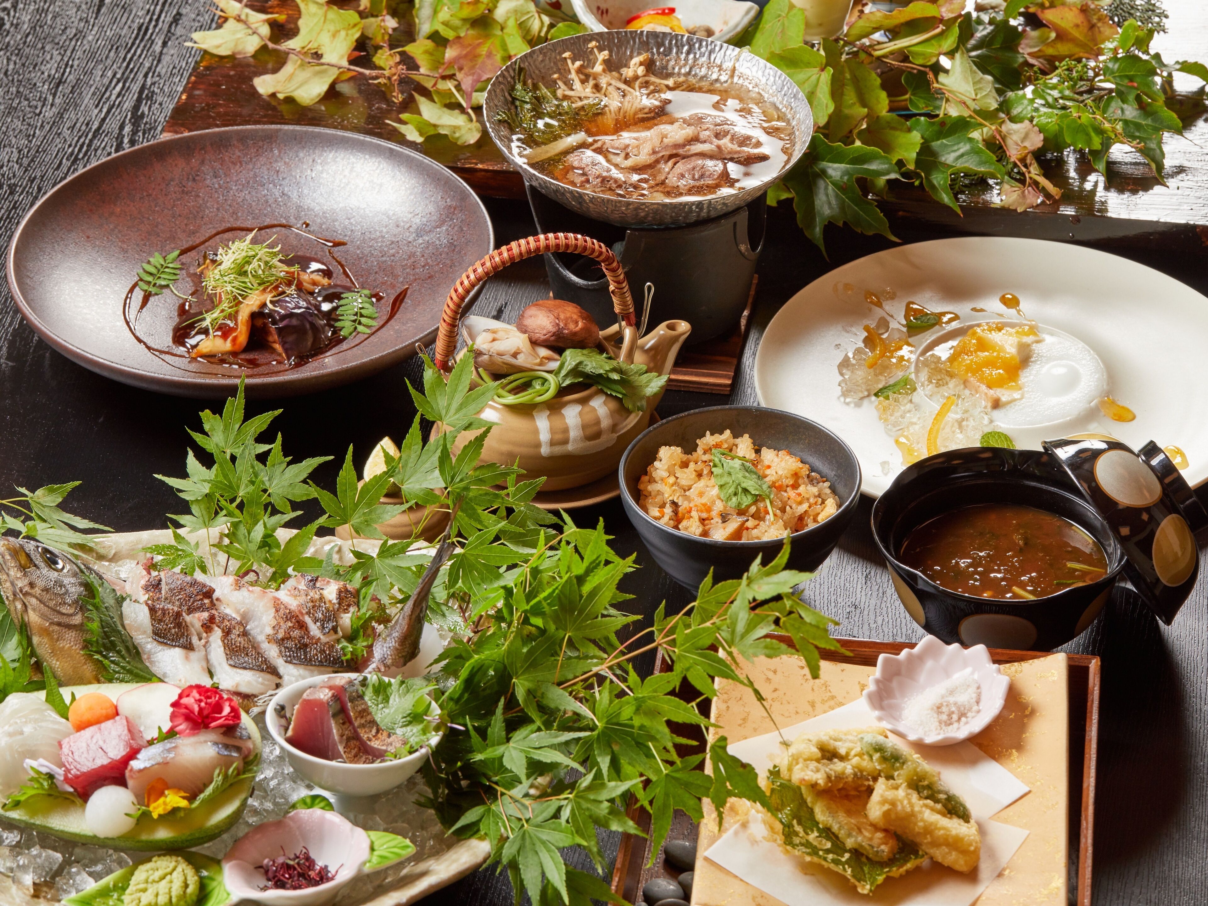 A variety of dishes and food items on a table.