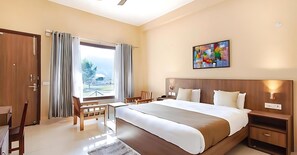 Deluxe Room | Free minibar items, in-room safe, laptop workspace, blackout drapes