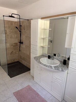 Shower, hair dryer, towels, soap