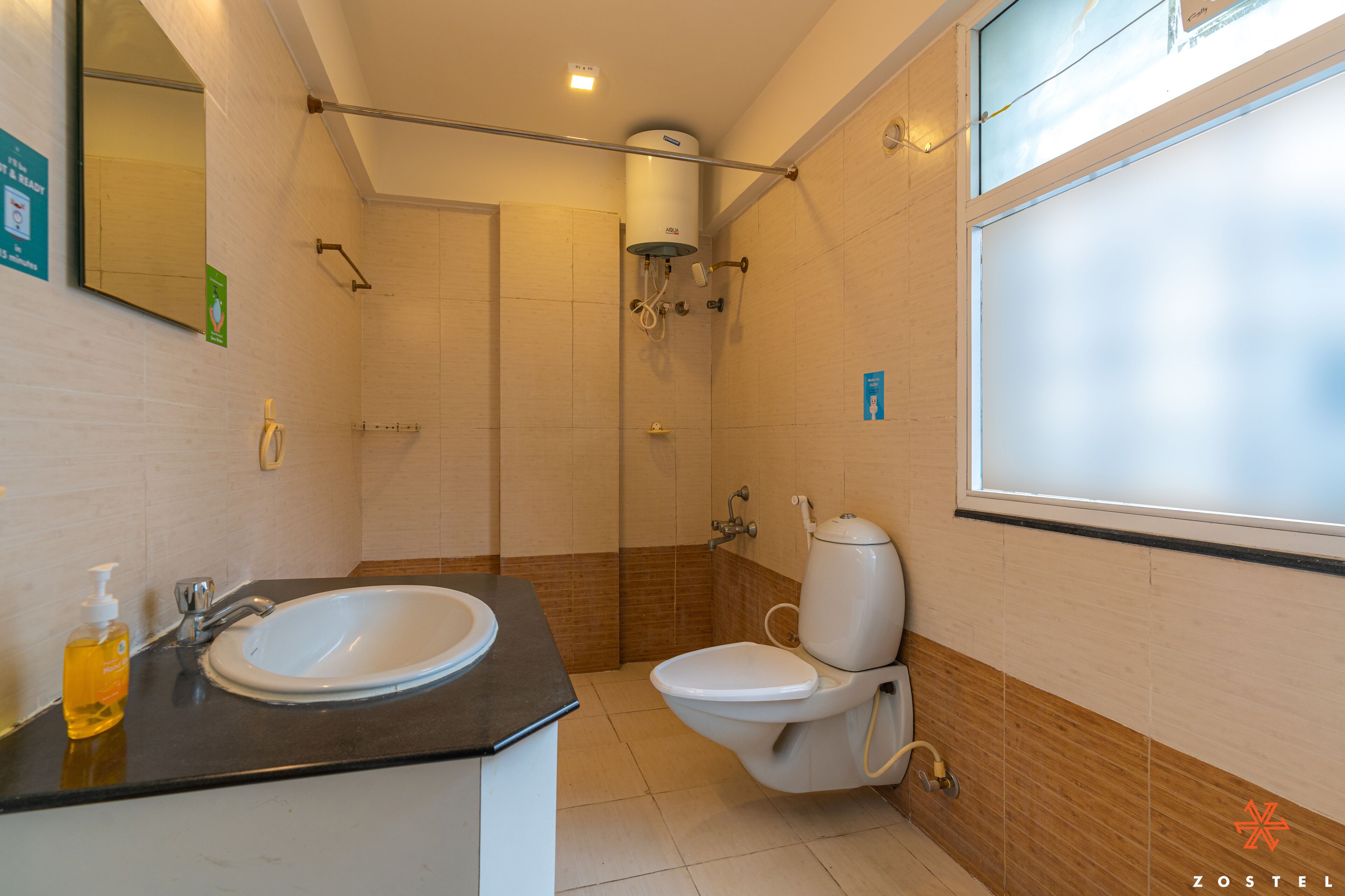 A bathroom with a sink, toilet, and shower.