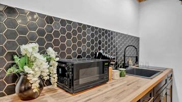 Fridge, microwave, stovetop, coffee/tea maker