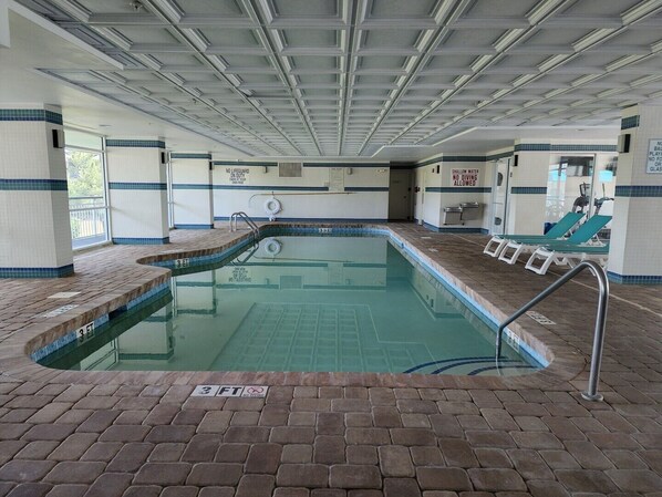 An indoor swimming pool with a 3 FT depth marker, lounge chairs, and a no diving sign. - Bridgewater 208 - Gorgeous 1 bedroom with Oceanfront Balcony (Pawleys Island)