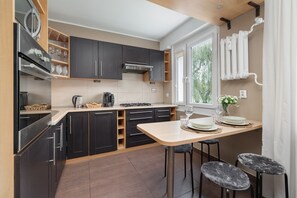 Apartment, 1 Bedroom, Balcony | Private kitchen | Microwave, dishwasher, coffee/tea maker, cookware/dishes/utensils - Ground Floor Apartment by Renters (Poznan)