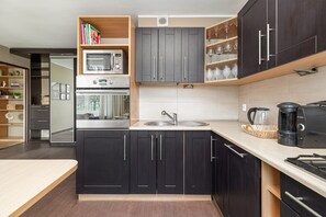 Apartment, 1 Bedroom, Balcony | Private kitchen | Microwave, dishwasher, coffee/tea maker, cookware/dishes/utensils - Ground Floor Apartment by Renters (Poznan)