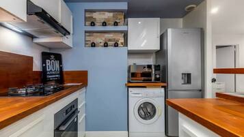 Fridge, microwave, oven, cookware/dishes/utensils