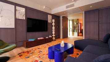 Superior Suite | Living area | 43-inch flat-screen TV with cable channels
