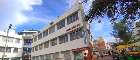A multi-story building with a restaurant on the ground floor.