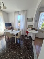 City Apartment | Living area | 42-inch Smart TV with digital channels