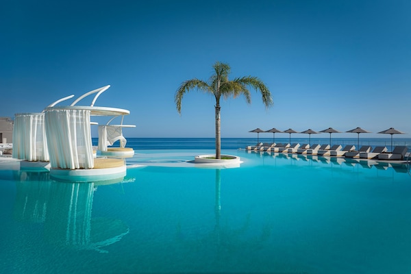 Seasonal outdoor pool, open 8:30 AM to 8:00 PM, pool umbrellas