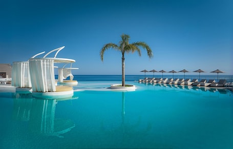 Seasonal outdoor pool, open 8:30 AM to 8:00 PM, pool umbrellas. Enorme Santanna Island