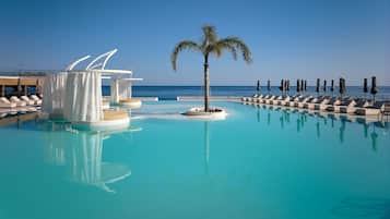Seasonal outdoor pool, open 8:30 AM to 8:00 PM, pool umbrellas