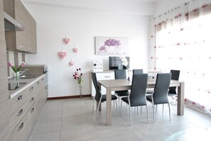 Family Apartment, 2 Bedrooms, City View | Living area | 30-inch flat-screen TV with cable channels - Smeralda Flats (Olbia)