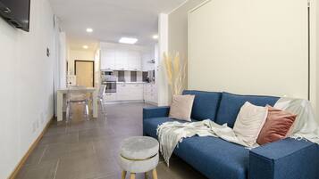 Comfort Apartment, 1 Bedroom | Living area | 30-inch flat-screen TV with cable channels