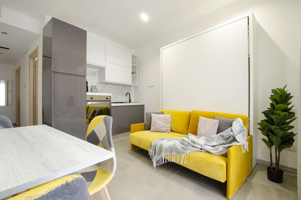 Business Apartment, 1 Bedroom, Patio, Courtyard Area | Living area | 30-inch TV with cable channels