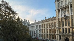 A large, historic building with a symmetrical facade, multiple windows, and a flag on top. - Stylish & Modern 1BD Flat - Chancery Lane! (London)
