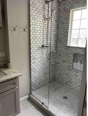Shower, hair dryer, towels, soap