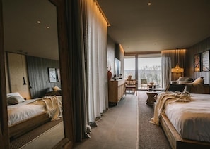 Luxe beddengoed, donsdekens, Tempur Pedic-bedden, een minibar