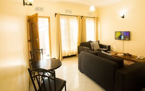 Smart TV - "Embrace Arusha's charm at Medan Hotel & Apartment: Your Ideal Stay!" (Arusha, Tanzania)