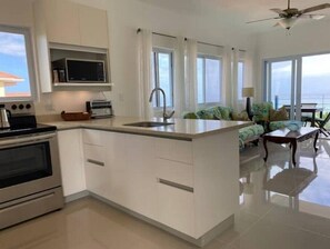 Fridge, microwave, oven, stovetop - Penthouse Gem on the Waterfront.
 (Tower Isle)