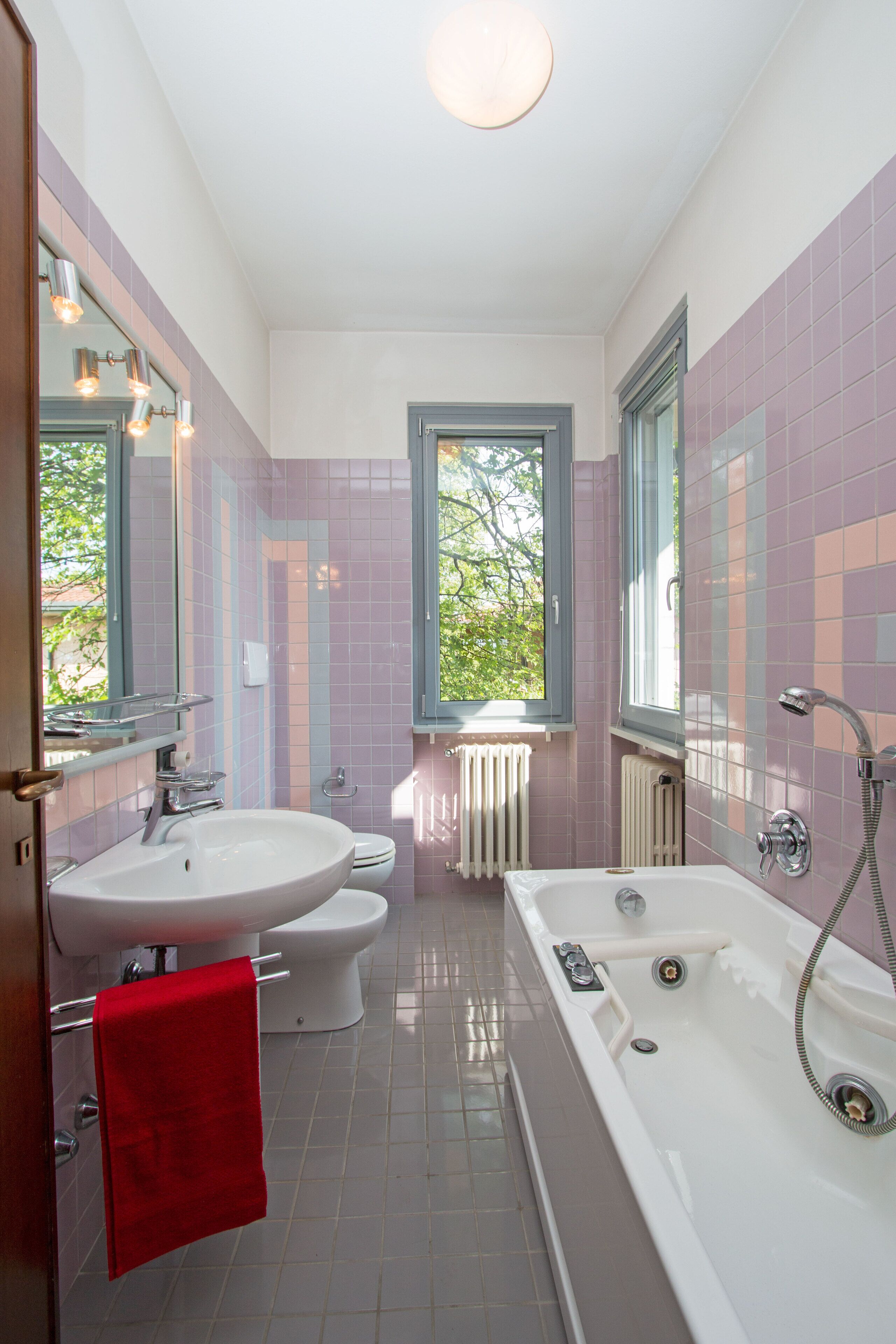 A bathroom with a bathtub, a sink, and a toilet.