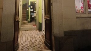 A hotel entrance with a number '20' above the door, a sign for 'AZUR HOTEL', and a patterned floor. - Hôtel Azur (Paris)