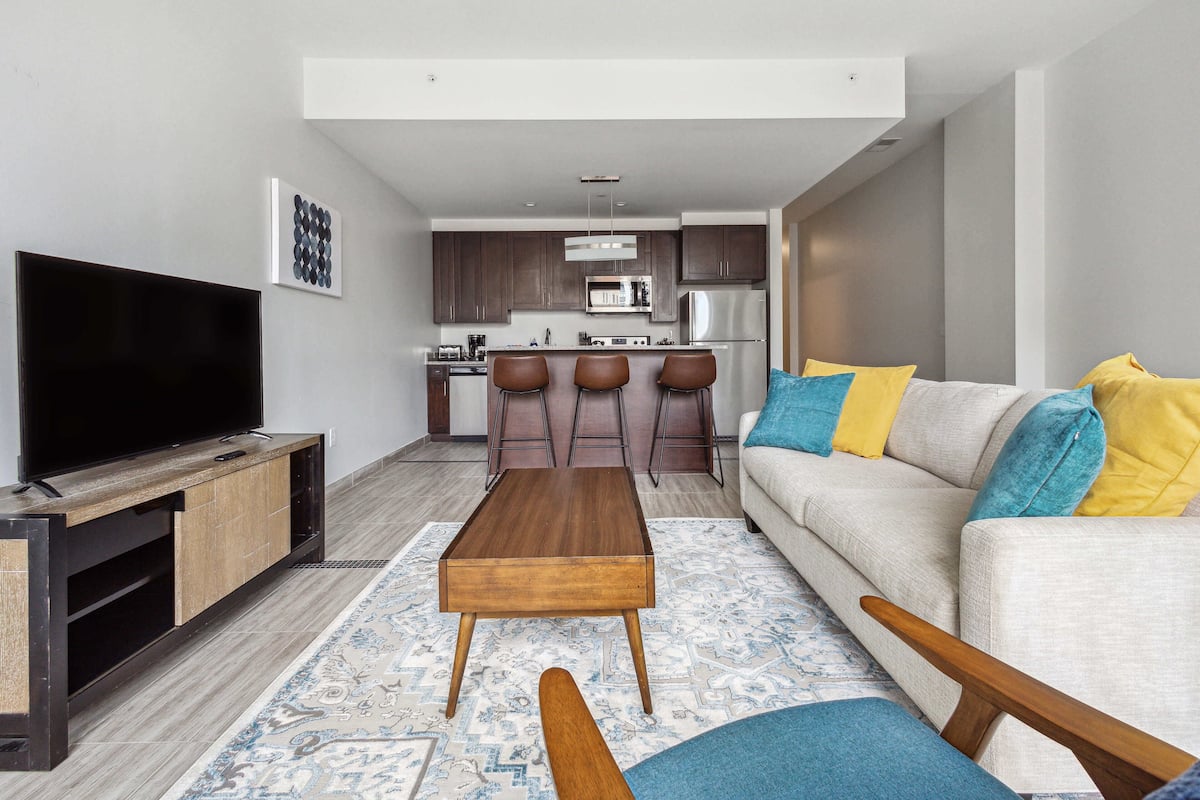 Deluxe Apartment | Living area | 70-inch Smart TV with digital channels