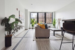 Comfort Apartment | Living area | 70-inch Smart TV with digital channels - Executive Downtown Retreat (Detroit)