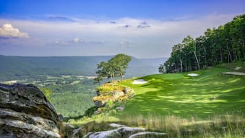 Golfers can enjoy a scenic game on the well-maintained fairways with trees and sand bunkers.