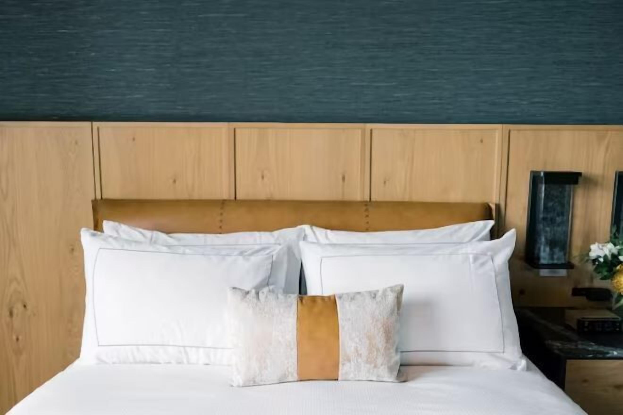 Premium bedding, down comforters, pillowtop beds, in-room safe