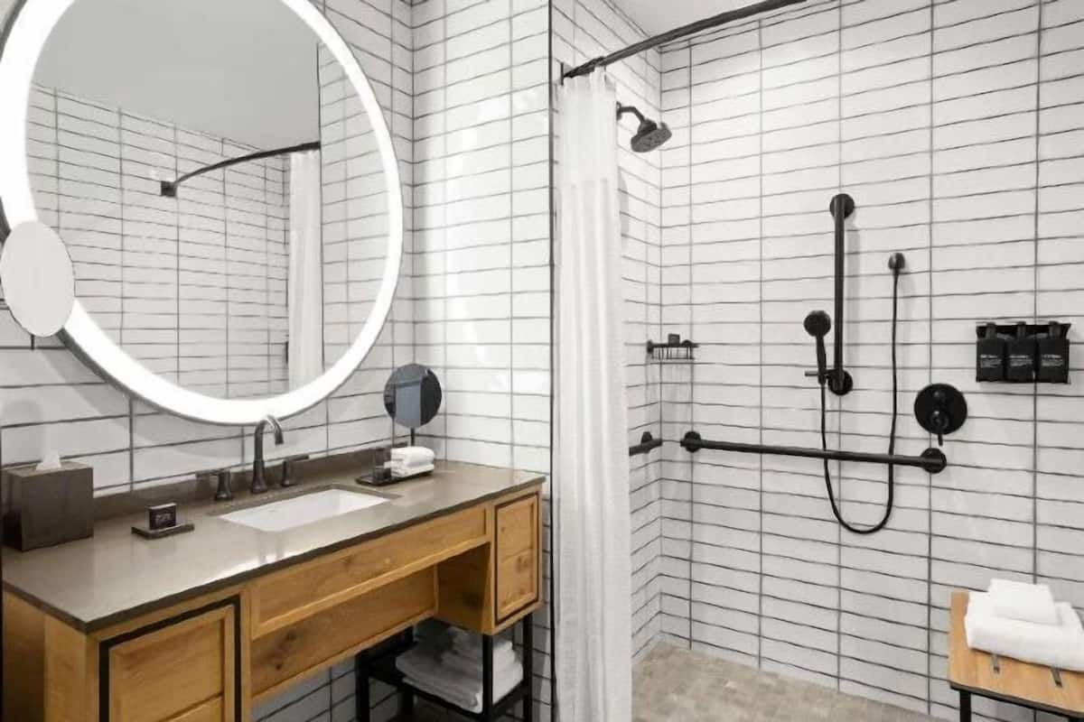 Bathroom | Designer toiletries, hair dryer, towels, soap