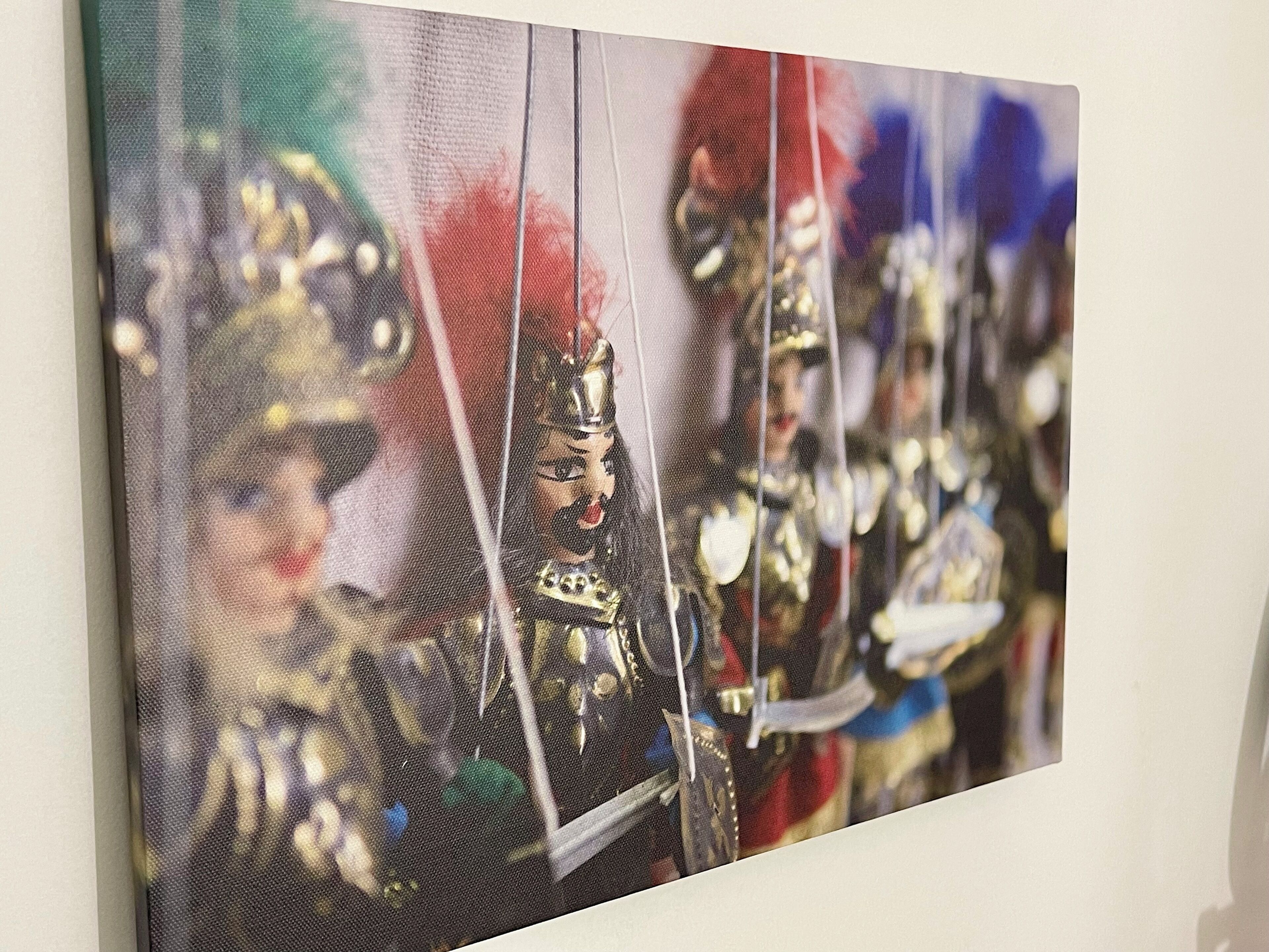 A painting with a blurred background, possibly depicting a historical or cultural scene.